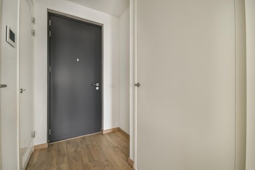 Modern room with wooden floor and white walls