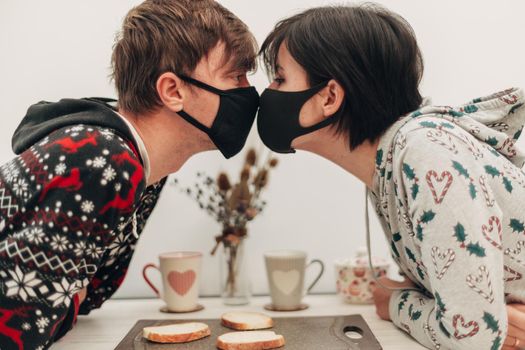 Girl and Boy Kissing in Masks on Coronavirus Quarantine.