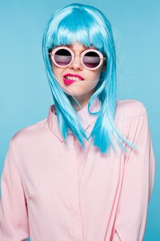 beautiful woman in blue wig sunglasses Glamor fashion. High quality photo