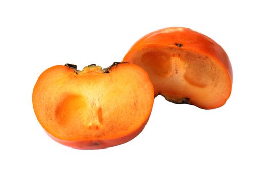 Ripe persimmons are cut in half separately placed on a white background. The polarity of the fruit is brown.