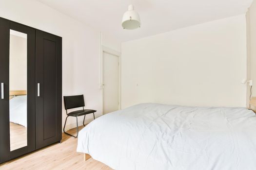 A bedroom in the light of day with a soft blue monochromatic synthphone cover