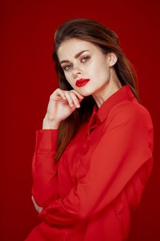 woman in red shirt posing fashion red lips fun. High quality photo