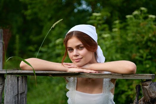 Woman in white dress countryside village nature ecology. High quality photo