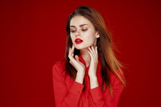 woman with red hair fashion posing red shirt glamor. High quality photo
