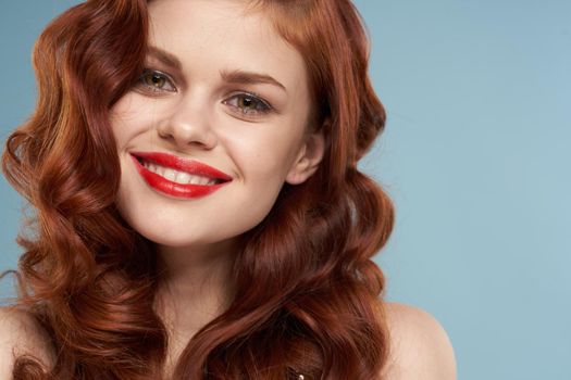 attractive red-haired woman red lips face close up. High quality photo