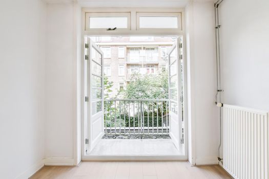 Bright room with open doors leading to the balcony
