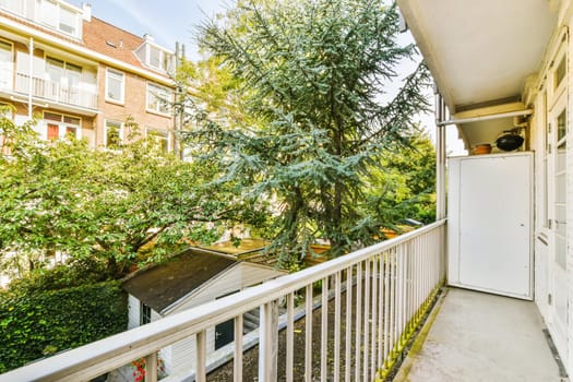 Attractive long narrow balcony with wooden handrails
