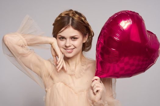 pretty woman in a dress balloon Valentine's Day isolated background. High quality photo