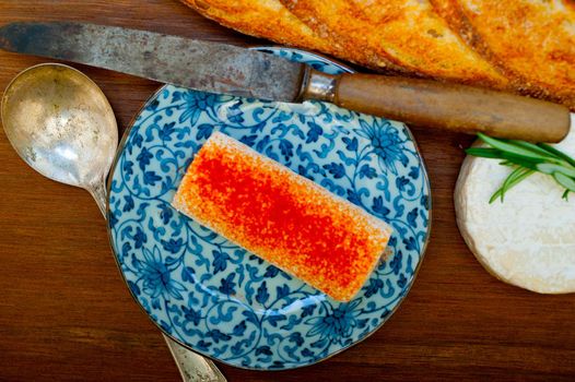 French cheese and fresh  baguette on a wood cutter