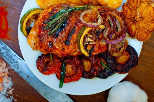 roasted grilled BBQ chicken breast with herbs and spices rustic style