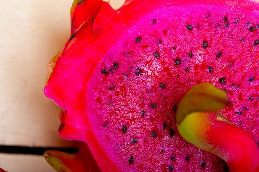 fresh thai purple dragon fruit over white rustic table