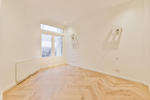 Modern room with wooden floor and white walls