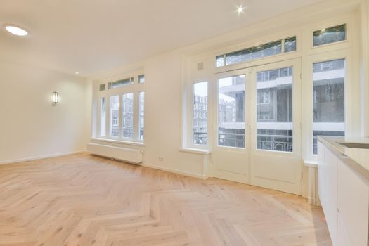 Modern room with wooden floor and white walls