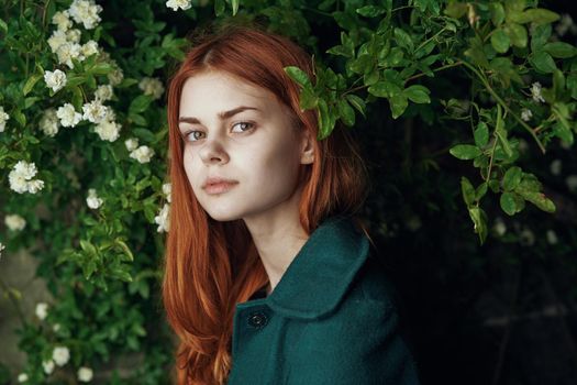 woman in green coat nature walk freedom fresh air. High quality photo