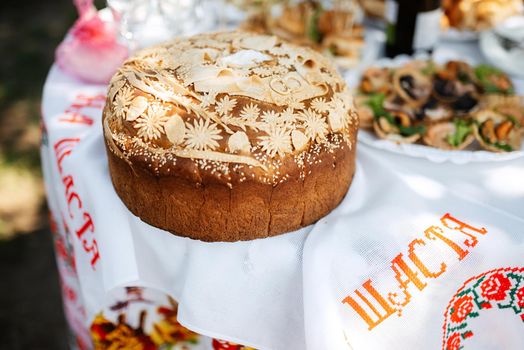 wedding bread loaf with voluminous twisted pigtails and decorations