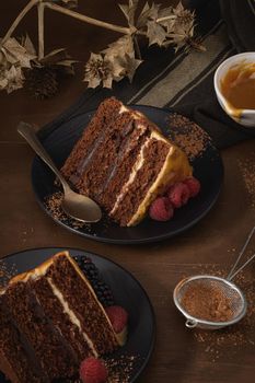 Delicious caramel cake slices with blackberries and raspberries.