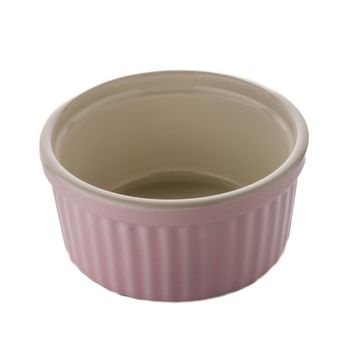 Pink ceramic bowl on white reflective background