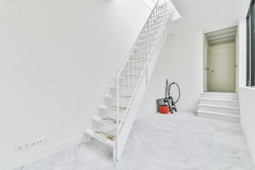 Magnificent bright room with a comfortable staircase