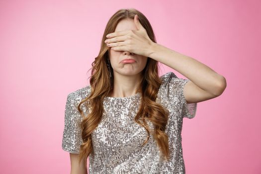 Intense whining sad girl cover eyes palm pursing lips unwilling see awkward disappointing scene, standing upset, saw unpleasant things, cannot unsee forget, standing miserable pink background.