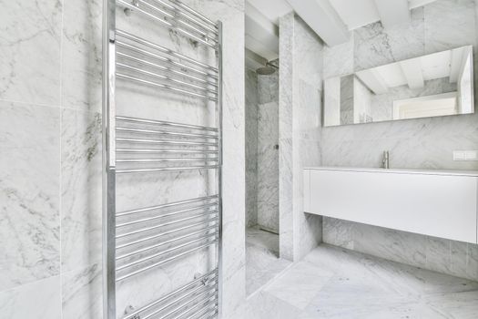 An elegant bathroom interior with big mirror