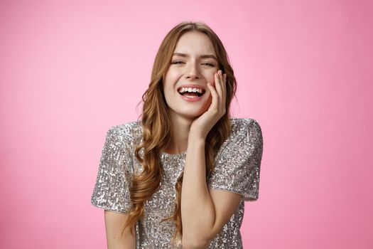 Haha so funny. Flirty coquettish attractive caucasian female laughing touching face feminine seduction gesture giggling showing interest talking amused, having fun enjoy cool party, pink background.