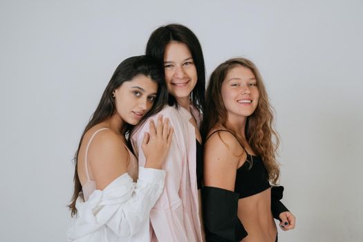 diverse models wearing comfortable underwear, enjoying time together, look at camera having smile and natural unique beauty