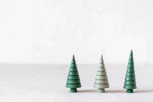 New Year and Christmas wooden decorative trees, zero waste concept, copy space, idea for Christmas card