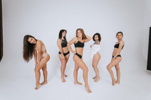 diverse models wearing comfortable underwear, enjoying time together, look at camera having smile and natural unique beauty