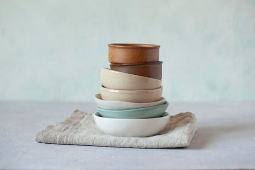 small bowls on the light green background, rustic style, selective focus