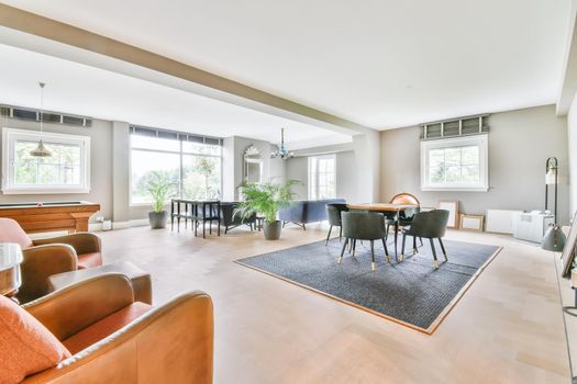 Stunning dining room with plush comfy and padded chairs and a small table