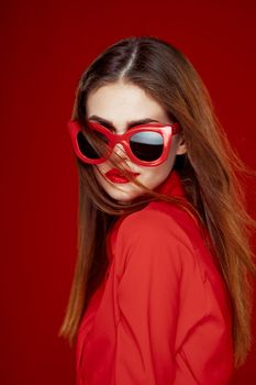 cheerful woman in a red shirt sunglasses Glamor close-up. High quality photo
