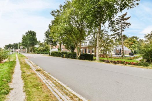 Beautiful well-groomed street with greenery on the sides