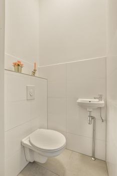 Interior of small clean restroom in miniature style
