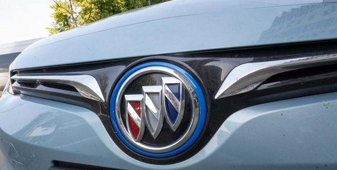 Logo of Chinese Electric vehicle Buick VeLite 6 on streets of Kyiv, near EV charging station. General Motors family next generation electric car based on Chevrolet Bolt technology . 17th of june 2021 Kyiv, Ukraine,. High quality photo