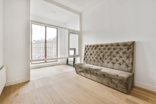 Modern room with wooden floor and white walls