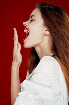 fashionable woman with red lips in red white dress isolated background. High quality photo