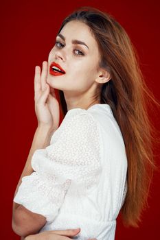 fashionable woman with red lips in red white dress isolated background. High quality photo