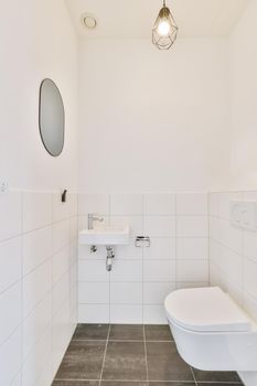 Attractive washroom with miniature sink and designer chandelier