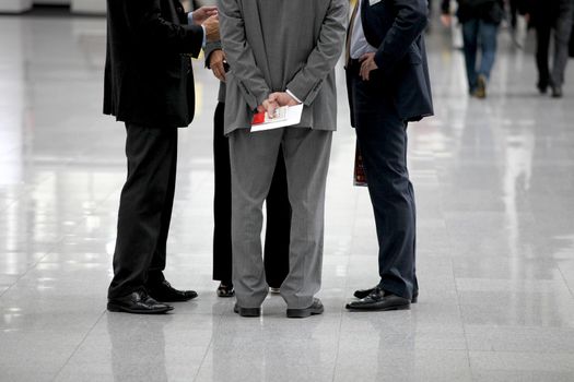 Four businessmen are negotiating in a circle - Photo