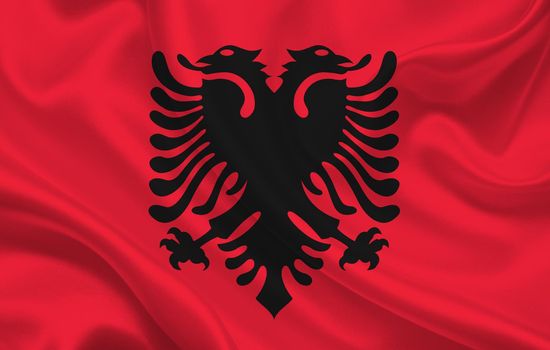 Flag of the country of Albania on a background of wavy silk fabric panorama