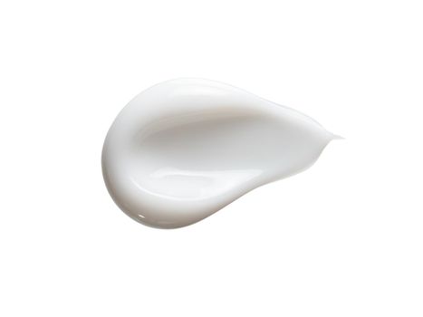 White cosmetic cream isolated on white background. Smear of face cream, sunscreen or moustirizer lotion swatch. Cosmetic smear of cream isolated on white background with clipping path