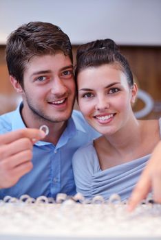 happy young romantic couple in love buy jewelry ring in luxury store