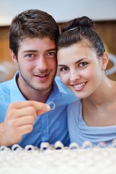 happy young romantic couple in love buy jewelry ring in luxury store