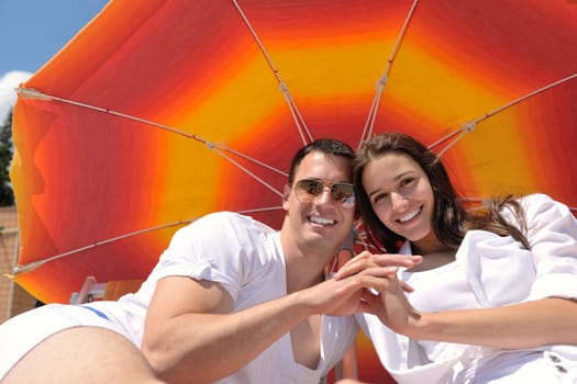 happy young romantic couple in love have fun running and relaxing on beautiful beach