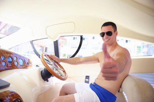 young happy man have fun on luxury boat yacht