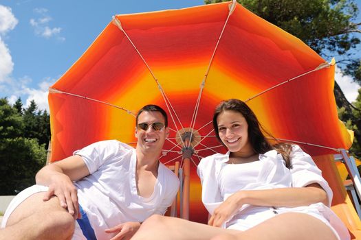 happy young couple have fun and relax  on the beach