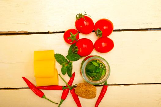 Italian pasta paccheri or schiaffoni with tomato mint and chili pepper ingredients