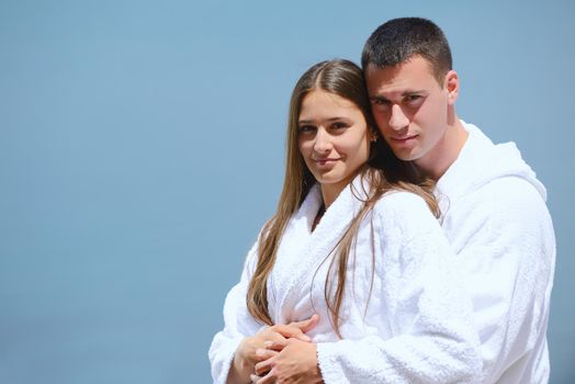 Romantic young couple spending time together and relaxing on yacht