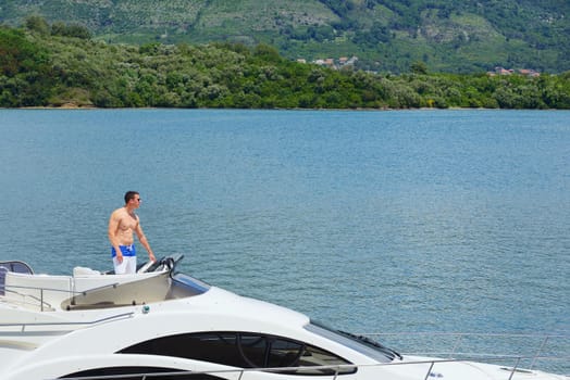 Romantic young couple spending time together and relaxing on yacht