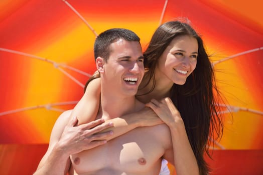 happy young romantic couple in love have fun running and relaxing on beautiful beach